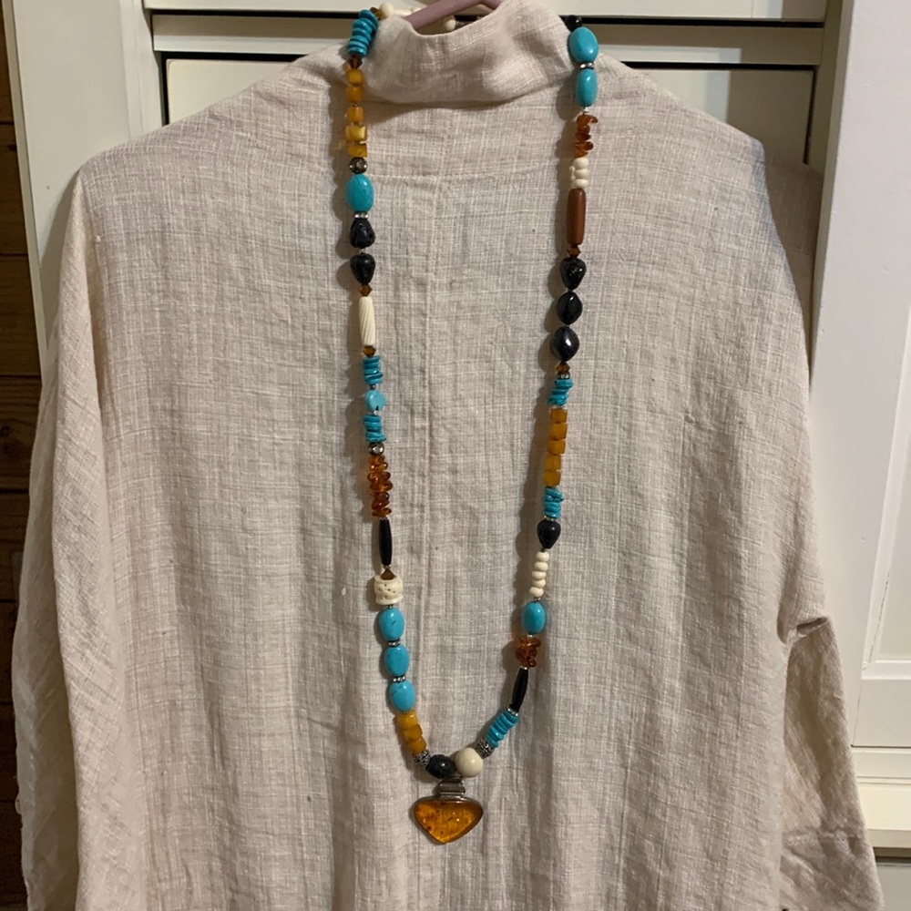 One of a kind necklace. Amber, turquoise, lava, magnetic clasp. Set in SS.Carved